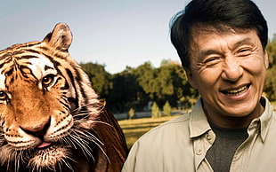 Jacky Chan beside tiger photo HD wallpaper